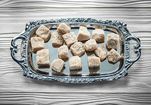 Brown sugar tray on wooden board.