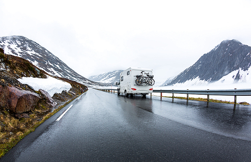 Caravan car travels on the highway. Beautiful Nature Norway natural landscape.