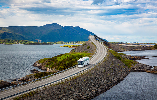 Tourist bus traveling on the road in Norway. Atlantic Ocean Road or the Atlantic Road (Atlanterhavsveien) been awarded the title as Norwegian Construction of the Century.