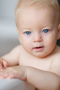 Baby boy with blue eyes portrait