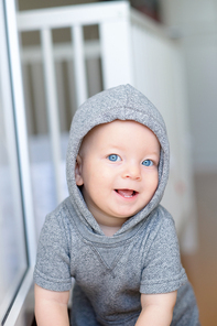 Baby boy with blue eyes portrait