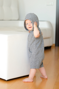 Baby boy with blue eyes wearing hoodie sweater