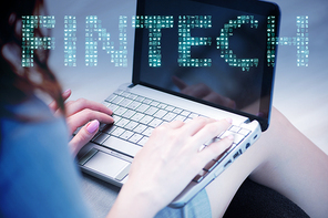 Hands working on laptop in financial technology fintech concept