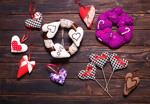 Variety of textile and wooden hearts on the holiday market. Valentine day