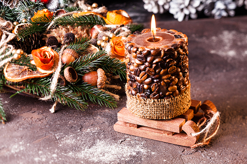 Christmas aromatic eco wreath with dry orange and anise stard, decorated tangerine peel roses