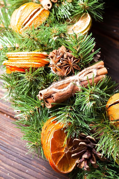 Christmas aromatic eco wreath with dry orange and cinnamon sticks, closeup details