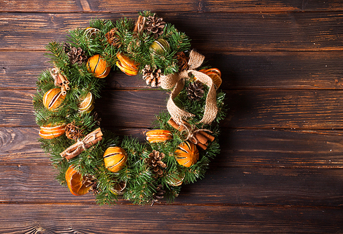 Christmas aromatic eco wreath with dry orange and cinnamon sticks, closeup details