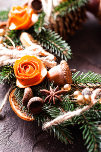 Christmas aromatic eco wreath with dry orange and anise stars, decorated tangerine peel roses, closeup details