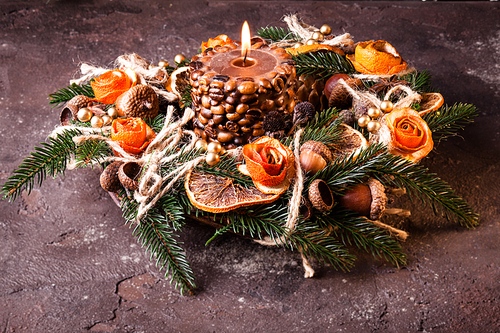 Christmas aromatic eco wreath with dry orange and anise stard, decorated tangerine peel roses