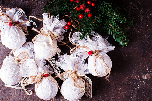Retro textile Christmas baubles with white lace and rope
