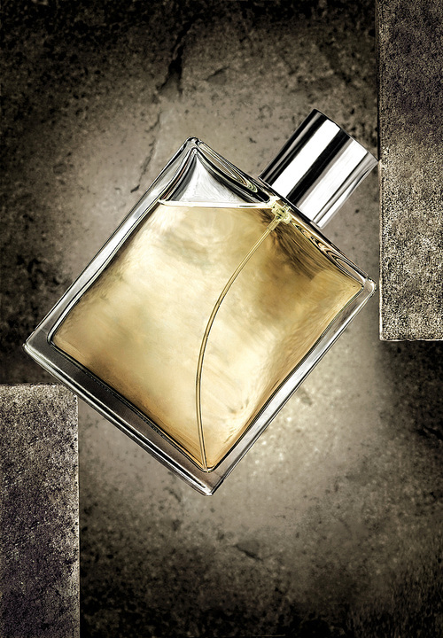 Luxury male perfume in a transparent spray bottle.