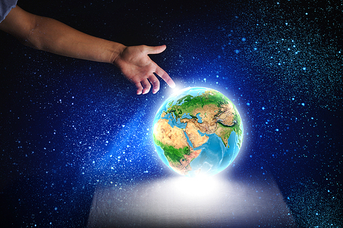 Close up of human hand holding Earth planet. Elements of this image are furnished by NASA