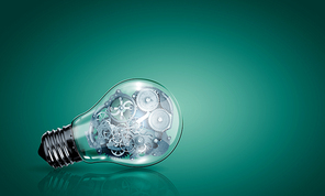 Conceptual image with light bulb filled with gears