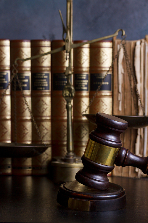Law and justice concept - law gavel with row of books