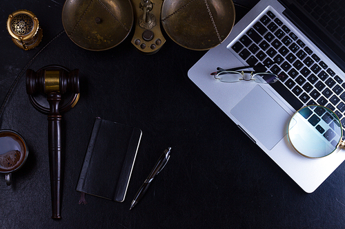 Workspace hero header with law gavel and laptop keyboard, top view flat lay scene