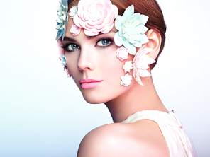 Face of Beautiful Woman Decorated with Flowers. Perfect Makeup. Beauty Fashion Model Woman Face perfect Skin. Paper Flowers