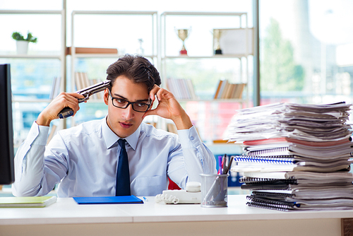 Angry businessman with gun thinking of committing suicide