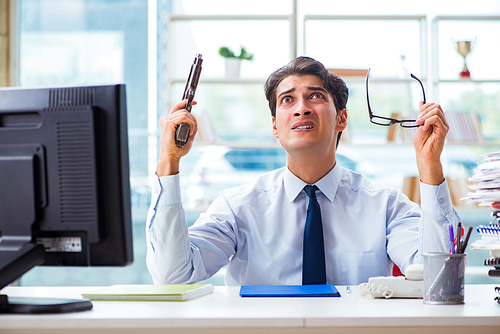 Angry businessman with gun thinking of committing suicide