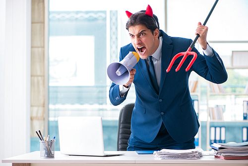 Devil angry businessman in the office