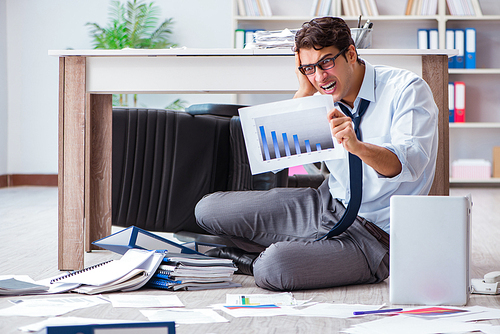 Bankrupt businessman angry in the office floor