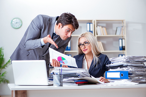 Angry irate boss yelling and shouting at his secretary employee