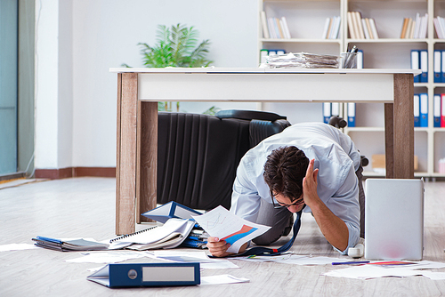 Bankrupt businessman angry in the office floor