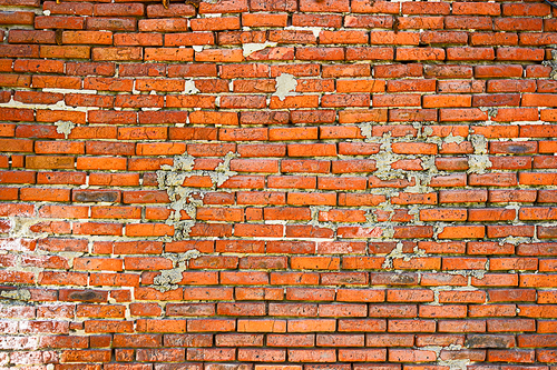 Background of old vintage looking brick wall of orange color