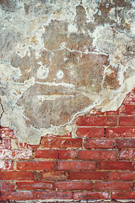 Ancient red brick wall with concrete on top half, copyspace for background.