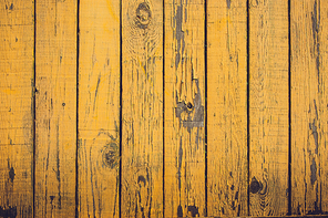 Grunge planks in yellow colors and peeling paint