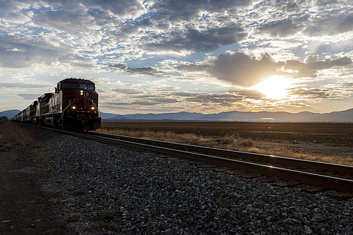 A train moves along on the tracks at sunrise on the Rathdrum Prairie in north Idaho.