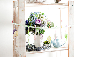 Hanging eggs on the ribbon - Easter decortaions on the shelf indoor
