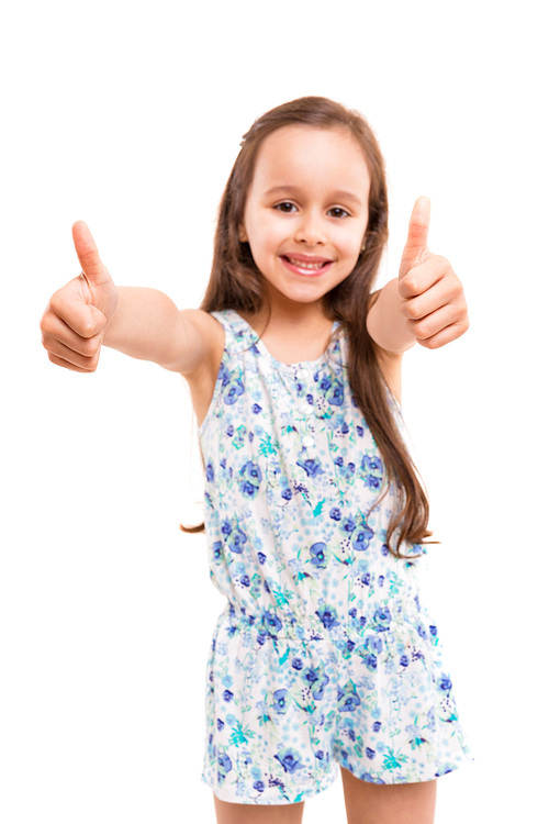 Small girl showing thumbs up, isolated over white background