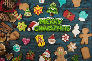 Gingerbreads for new years and christmas on wooden background, xmas theme