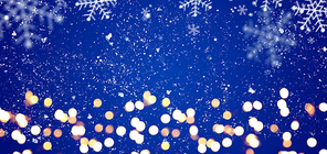 Blue festive Christmas or New Year background with shiny golden baubles