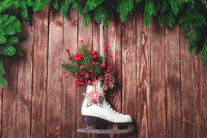 Christmas decorated skate on the wooden wall