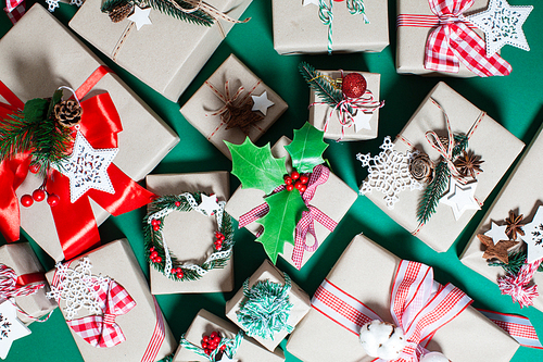 Christmas craft boxes decorated in vintage and natural style, top view with copy space