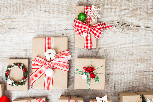 Christmas craft boxes decorated in vintage and natural style, top view with copy space