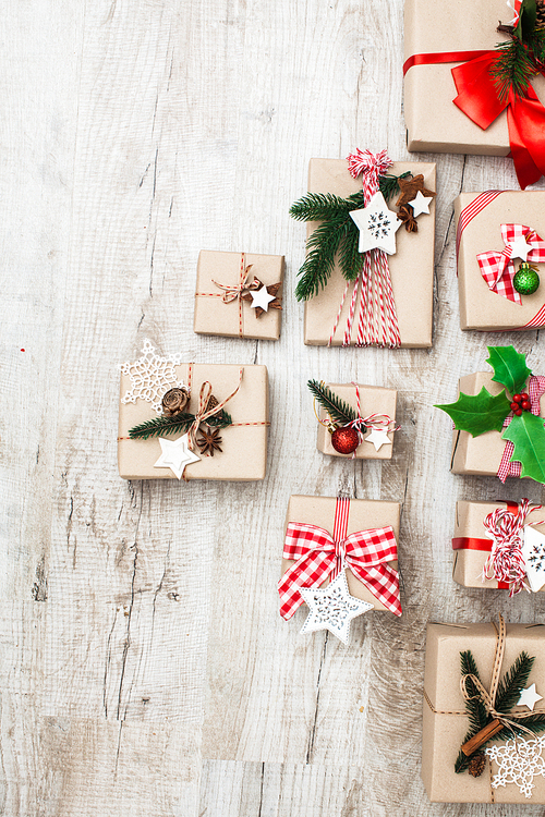 Christmas craft boxes decorated in vintage and natural style, top view with copy space