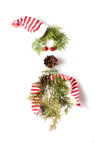 Gnome or elf face from natural materials. Christmas silhouette picture in minimalistic design concept
