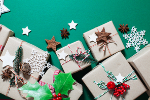 Christmas craft boxes decorated in vintage and natural style, top view with copy space