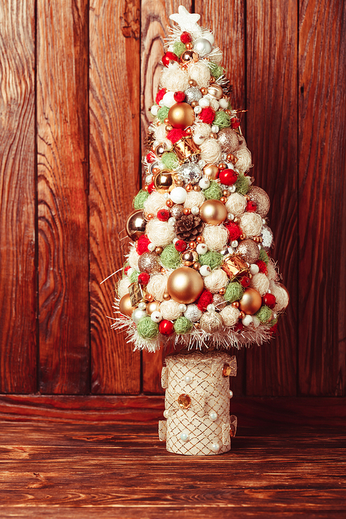 Handmade Christmas tree over wooden background, copy space