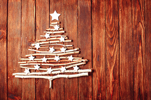 Birch branches and white stars in a shape of christmas tree