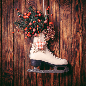 Christmas decorated skate on the wooden wall