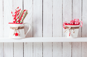 Christmas declrated dishware on a kitchen wooden shelf