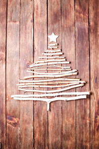 Birch branches and wooden star as a decor for Christmas with copy space