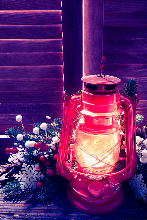 Kerosene lamp in the night on the window outdoor, Christmas decorations