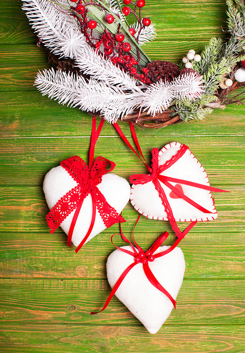 Christmas vintage decorated toy for home and tree, white and red elements with laces and ribbons on felt