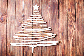 Birch branches and wooden star as a decor for Christmas with copy space