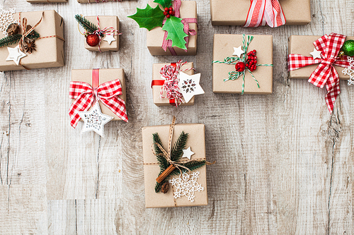 Christmas craft boxes decorated in vintage and natural style, top view with copy space