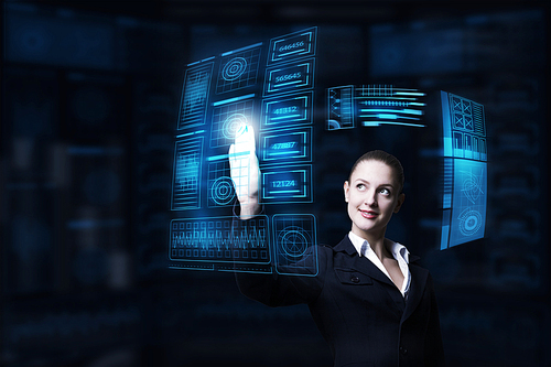 Attractive smiling businesswoman working with virtual panel interface
